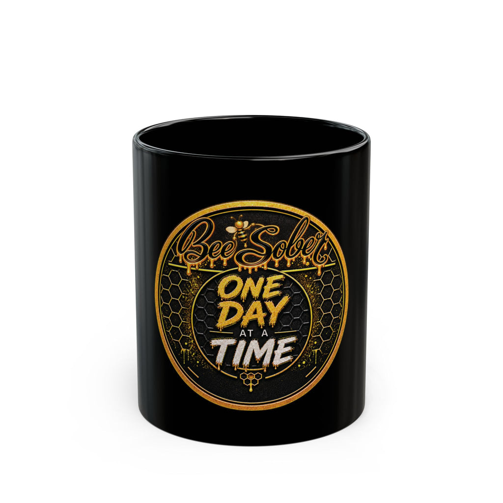 Black 11 oz Bee Sober ceramic mug with gold One Day at a Time artwork, front view