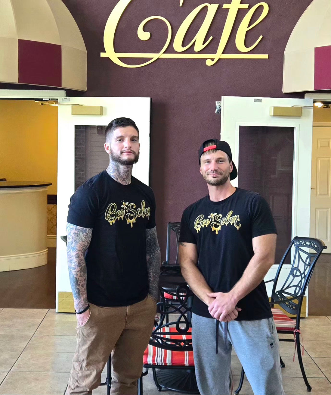 Bee Sober founders Aaron and B wearing black Bee Sober shirts.